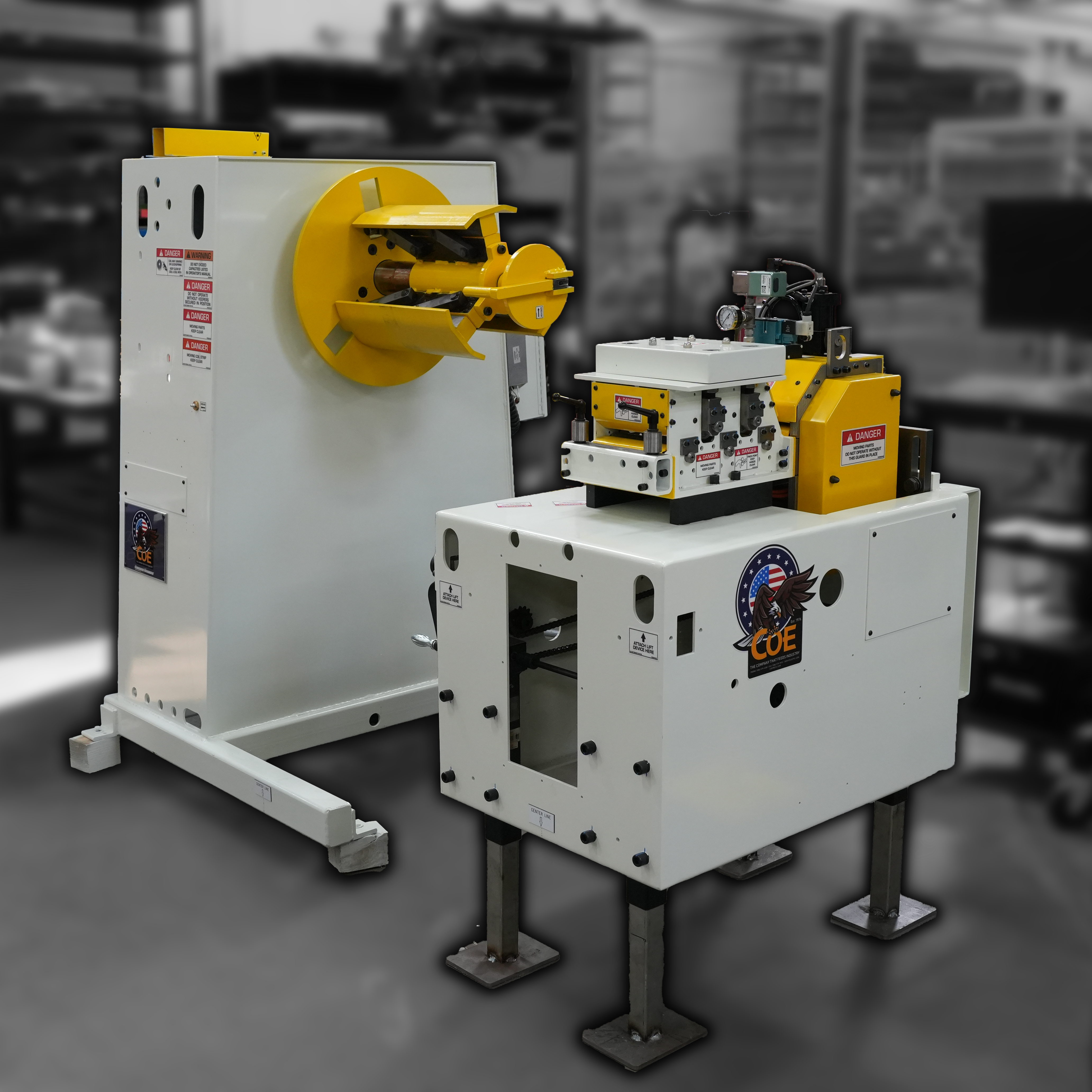 Two industrial machines displayed prominently in a manufacturing facility. The foreground features a pull through straightener and feeder combo in front of a 4000# coil reel. The background is burred and grayscale with the machines colored yellow and white.